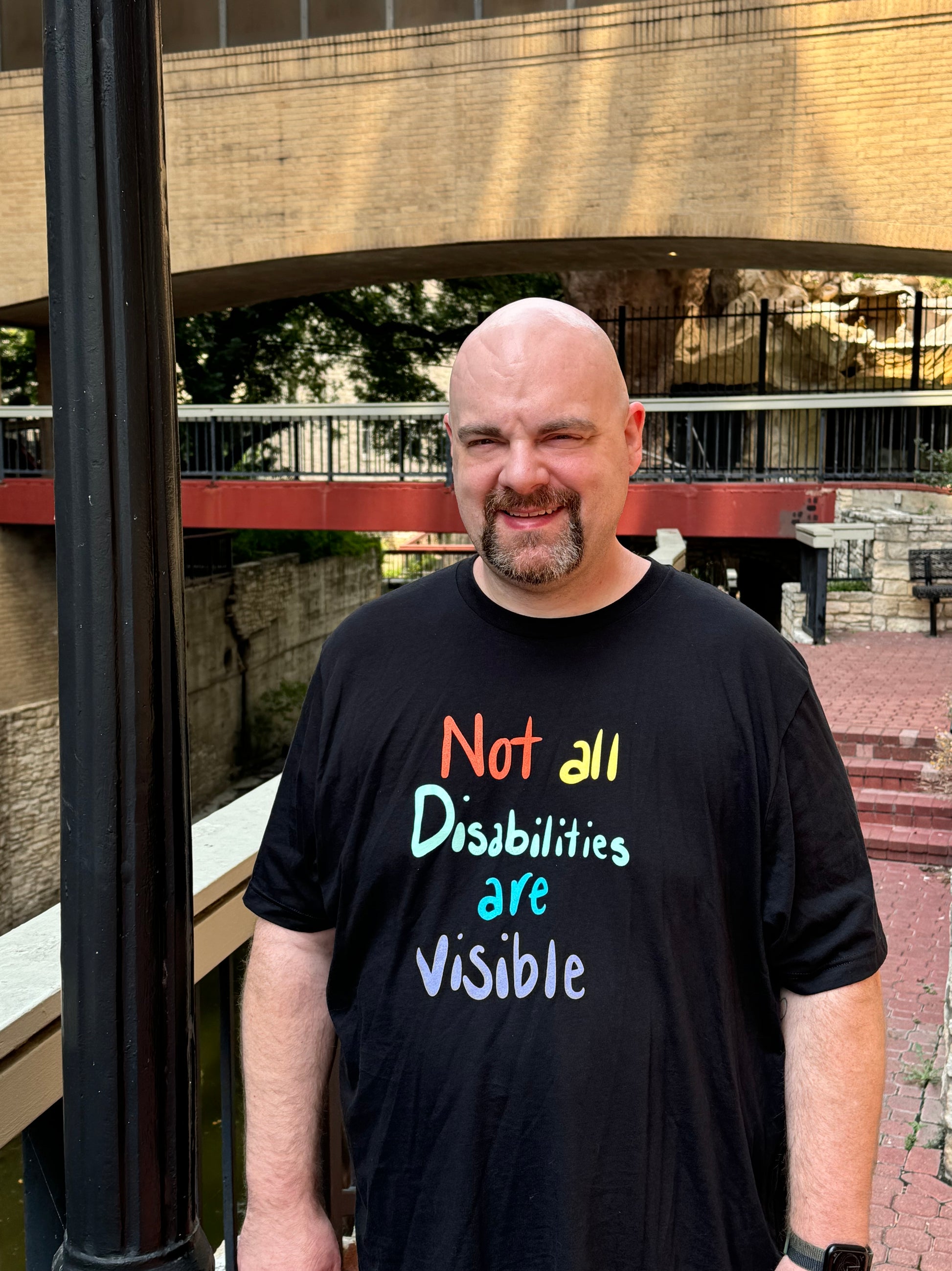 Masc presenting model wearing shirt